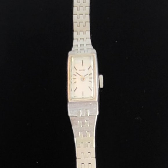 Seiko Accessories - Seiko silver tone watch with long rectangular face sold AS IS